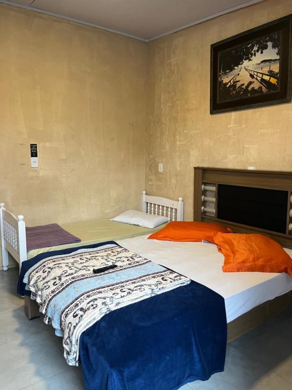 Postel nebo postele na pokoji v ubytování Suites Para Passeio No Parque