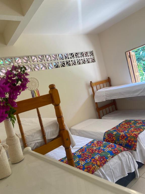 Postel nebo postele na pokoji v ubytování Alecrim Hostel e Pousada