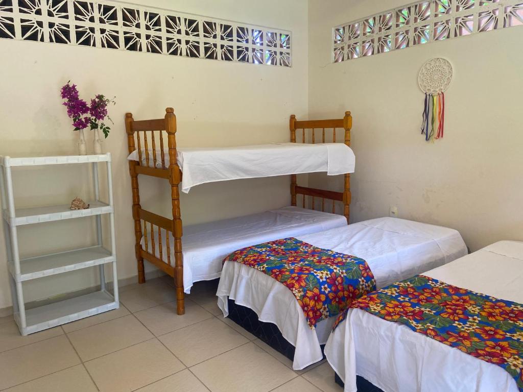 Postel nebo postele na pokoji v ubytování Alecrim Hostel e Pousada