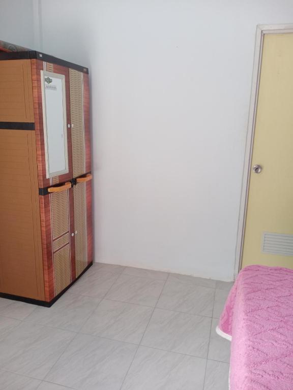 Postel nebo postele na pokoji v ubytování Sulis homestay