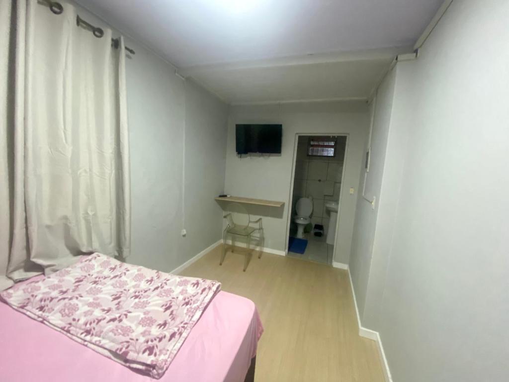TV a/nebo společenská místnost v ubytování Pousada da Laís