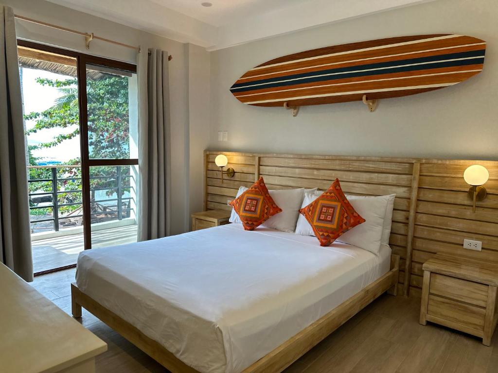 Postel nebo postele na pokoji v ubytování Reside Siargao