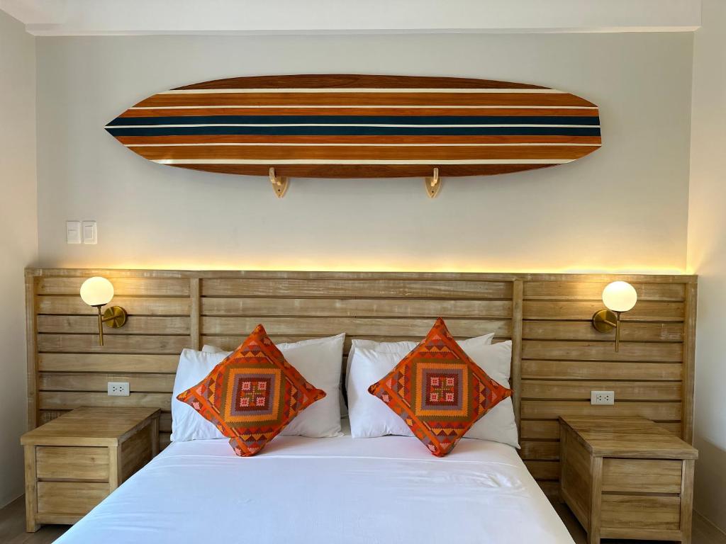 Postel nebo postele na pokoji v ubytování Reside Siargao