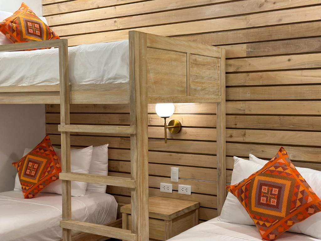 Postel nebo postele na pokoji v ubytování Reside Siargao