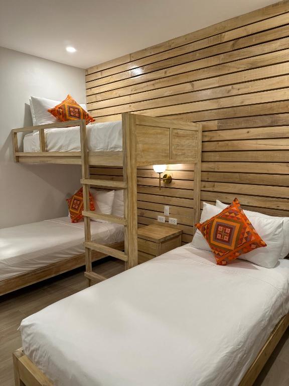 Postel nebo postele na pokoji v ubytování Reside Siargao