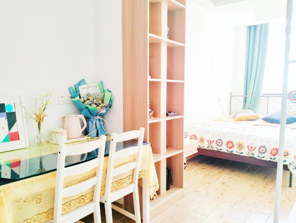 Postel nebo postele na pokoji v ubytování 秋雨星宿