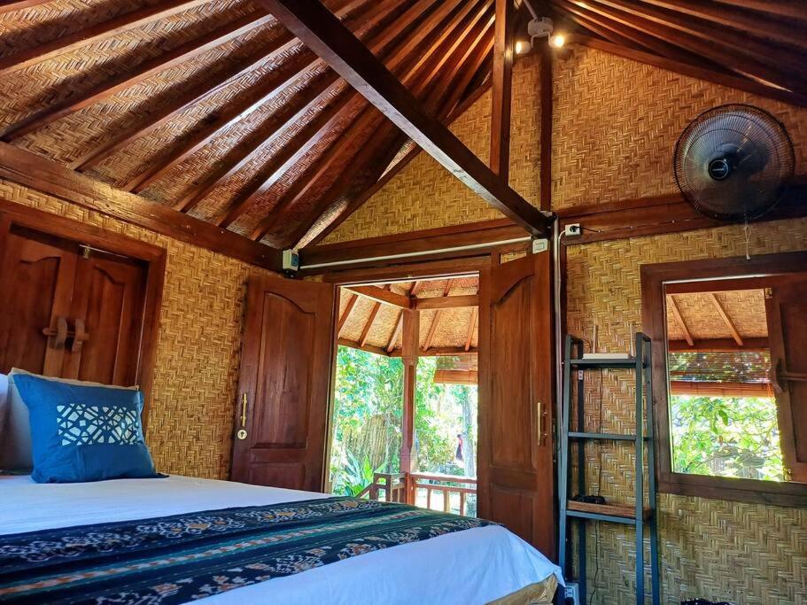 Ένα ή περισσότερα κρεβάτια σε δωμάτιο στο Kimbaran Bungalow