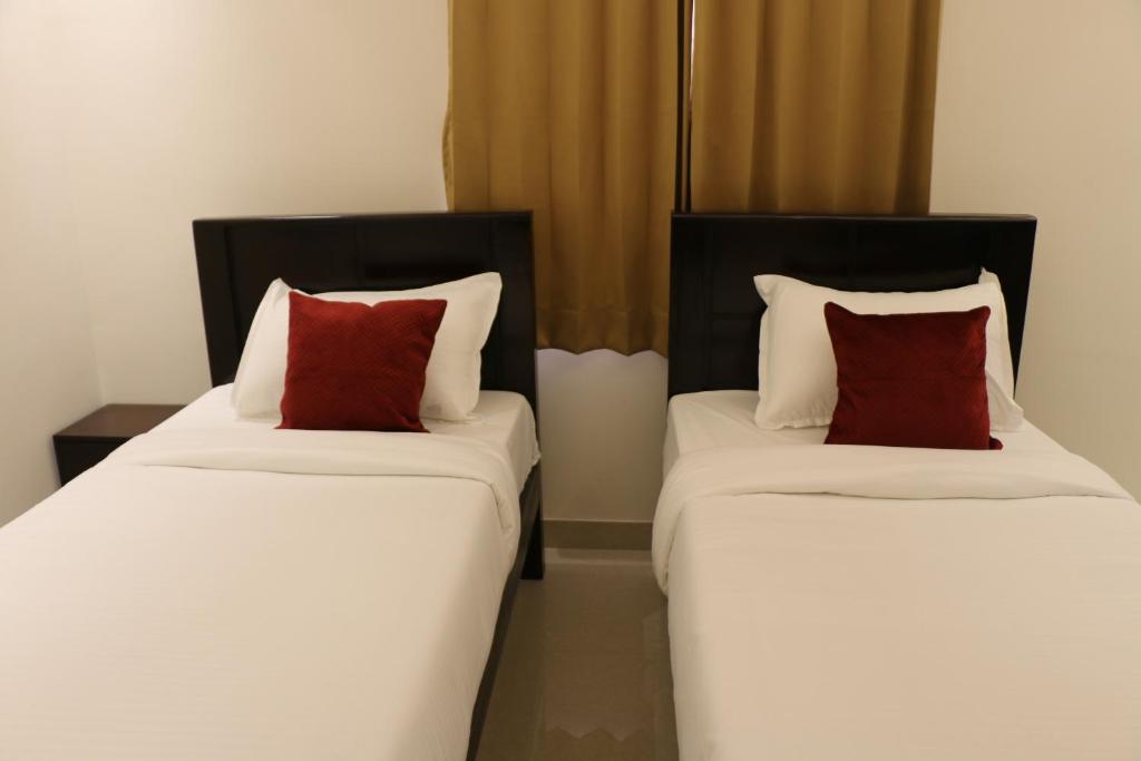 Postel nebo postele na pokoji v ubytování Vibha by Sri Lakshmi Homes