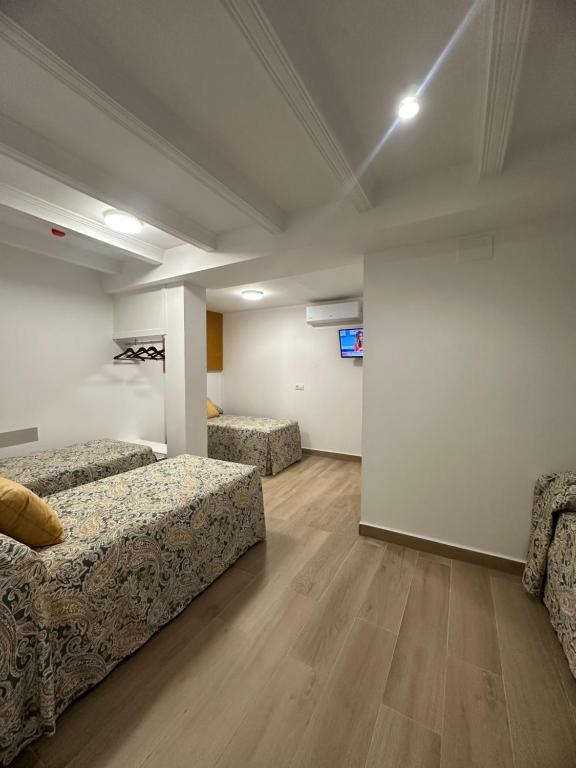 Postel nebo postele na pokoji v ubytování Hotel Quitagolpe