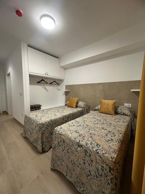 Postel nebo postele na pokoji v ubytování Hotel Quitagolpe