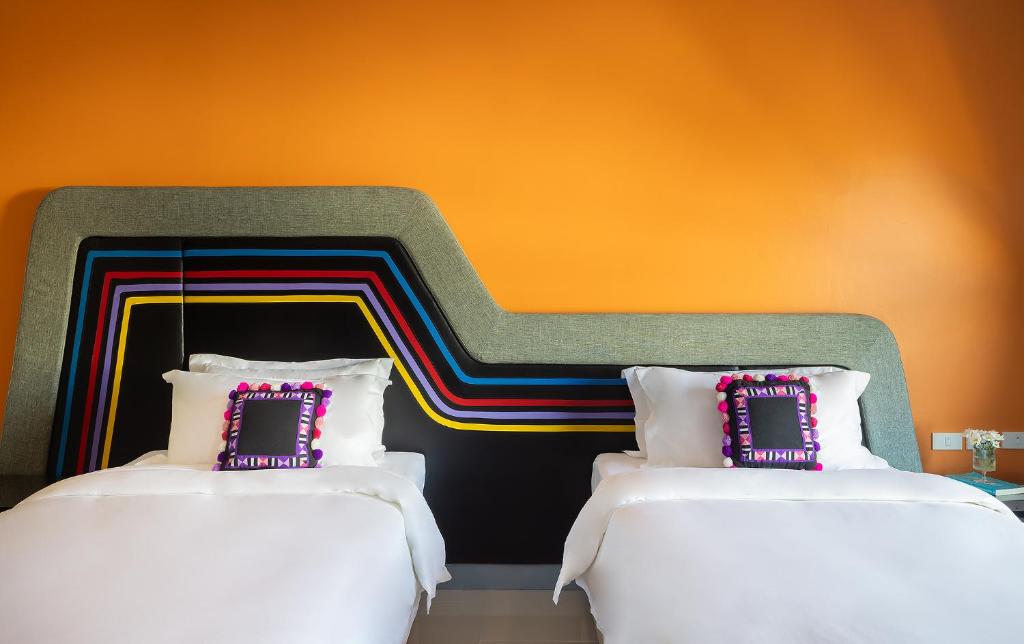 Postel nebo postele na pokoji v ubytování Hotel Selene Chiang Rai - SHA Certified