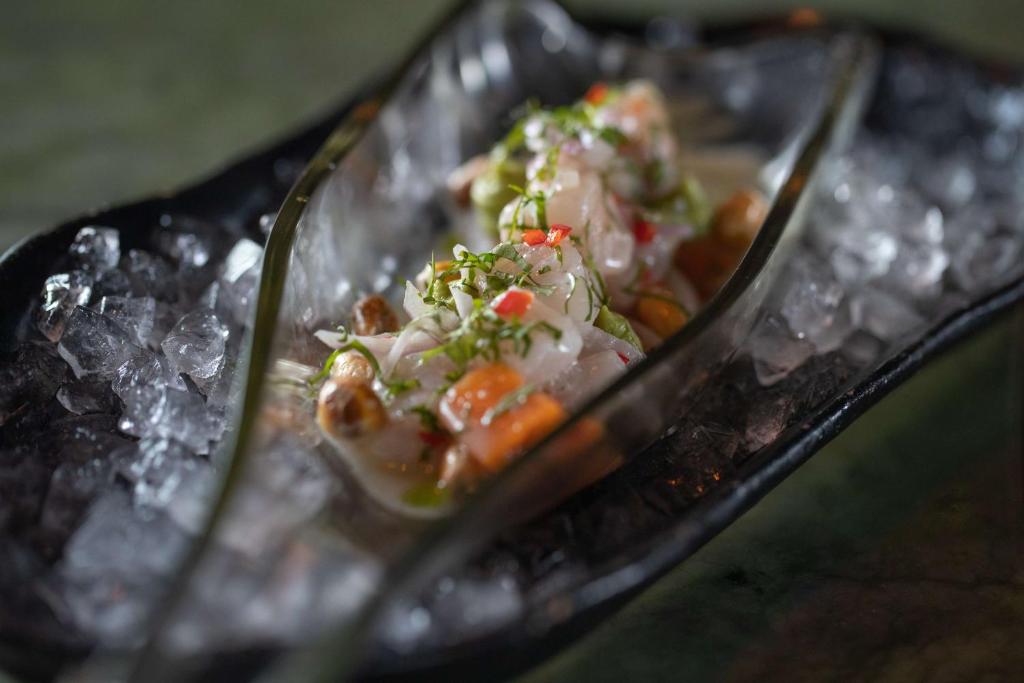 a plate of food on a tray of ice at Conrad Abu Dhabi Etihad Towers in Abu Dhabi