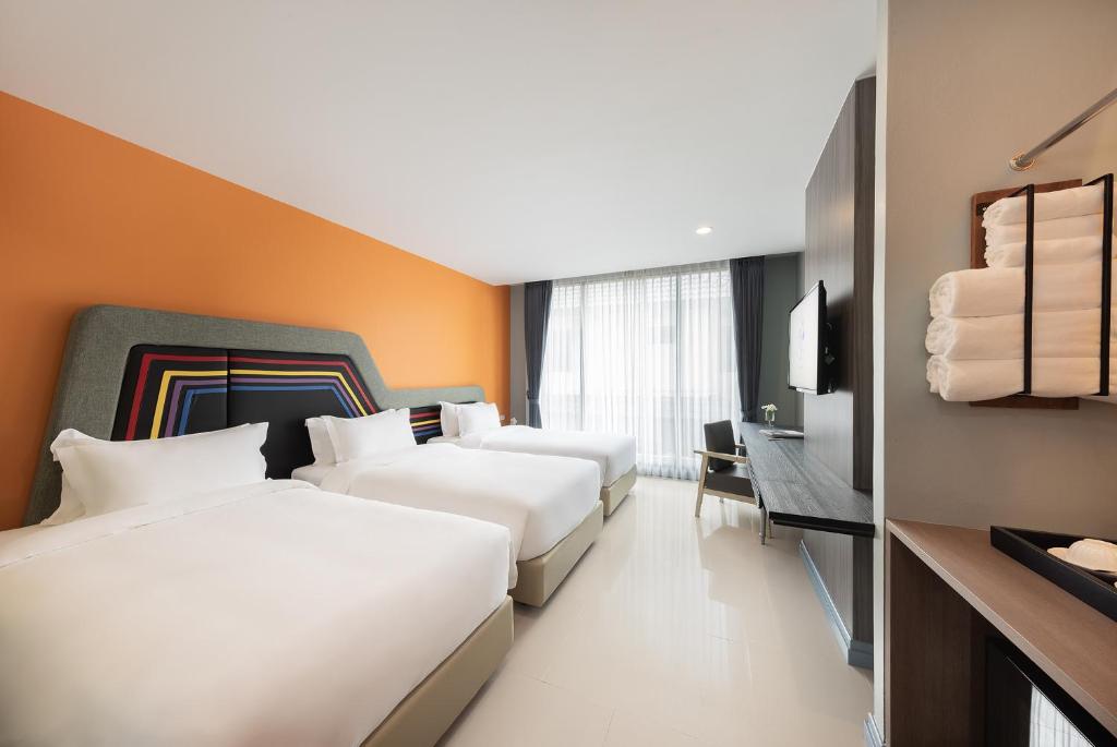 Postel nebo postele na pokoji v ubytování Hotel Selene Chiang Rai - SHA Certified