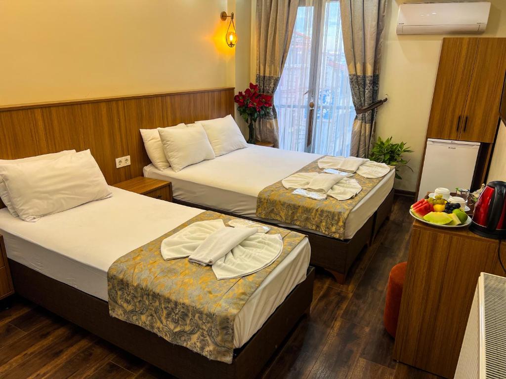 Postel nebo postele na pokoji v ubytování Hotel By Historia