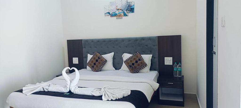 Postel nebo postele na pokoji v ubytování Hotel Baga inn