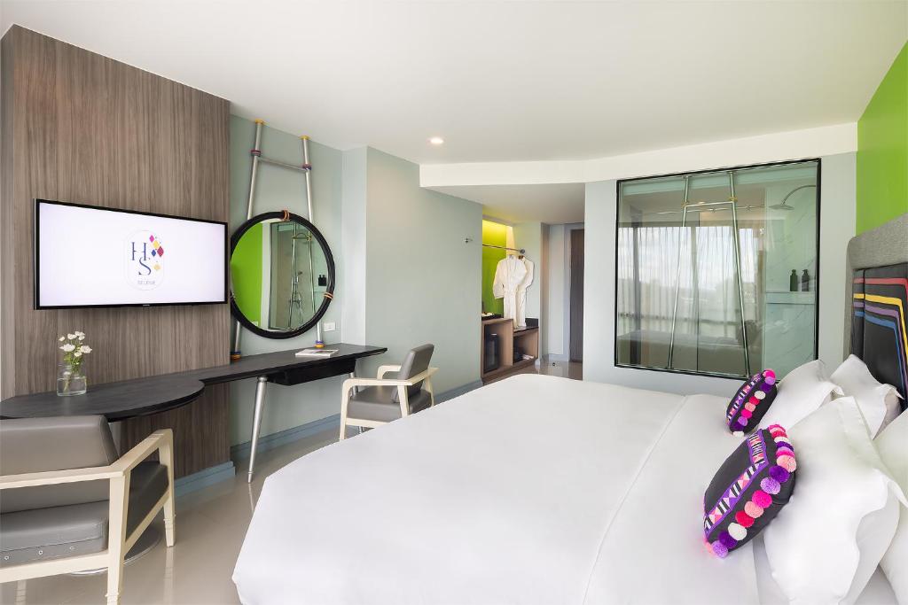 Postel nebo postele na pokoji v ubytování Hotel Selene Chiang Rai - SHA Certified