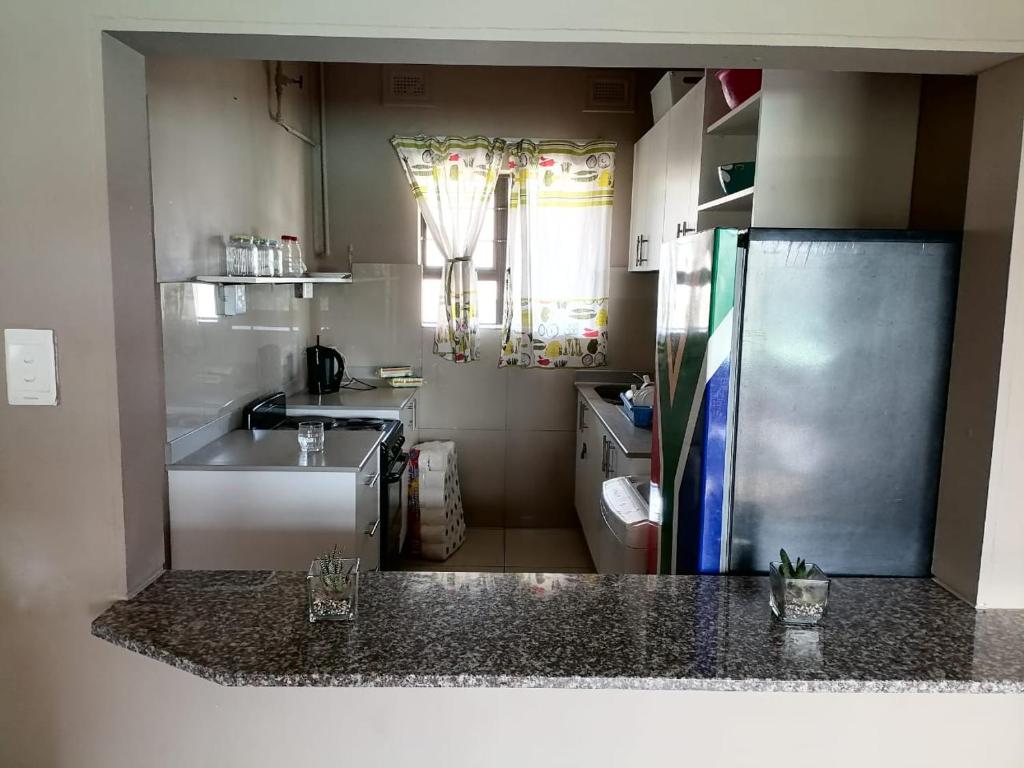 Kuchyň nebo kuchyňský kout v ubytování Loscona flat