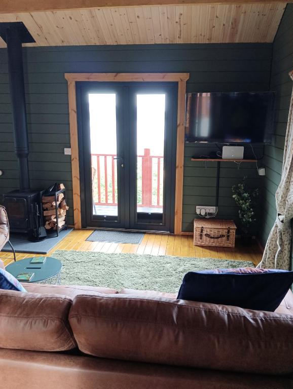 Posezení v ubytování Ghillie's Croft Cabin, Rothesay