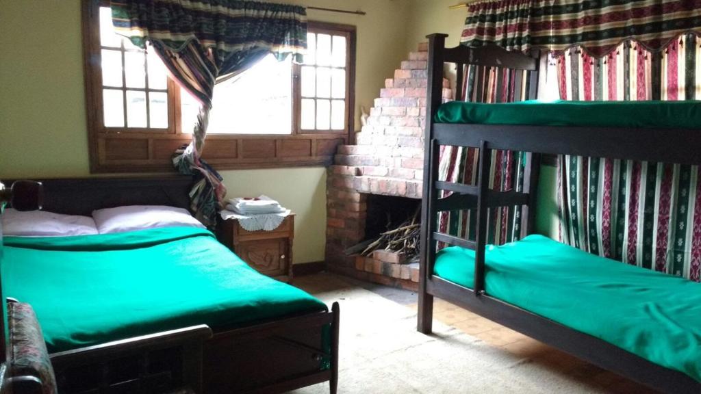 Postel nebo postele na pokoji v ubytování Hotel Campestre los Duraznos