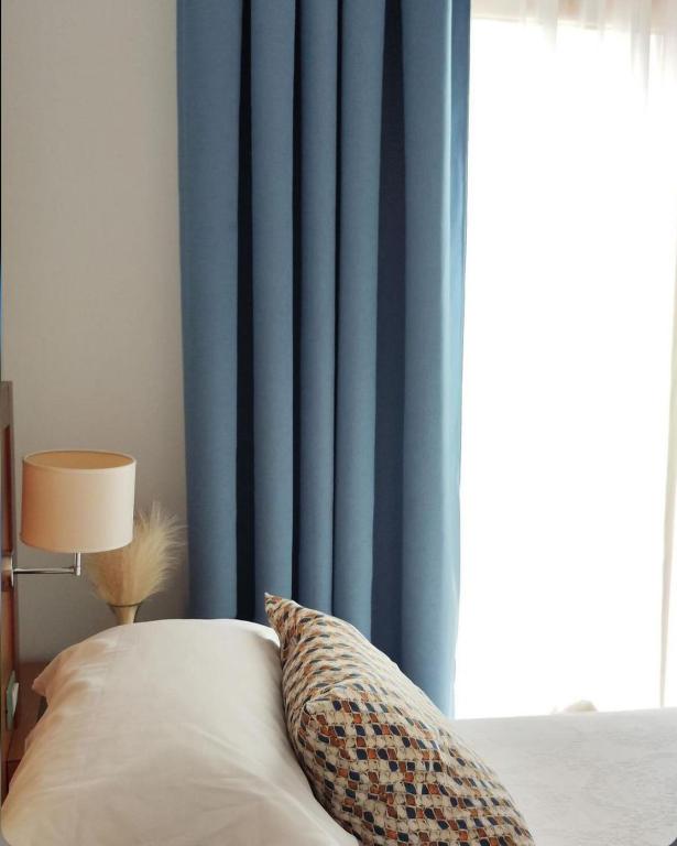 Postel nebo postele na pokoji v ubytování Hotel Scoglio Degli Achei
