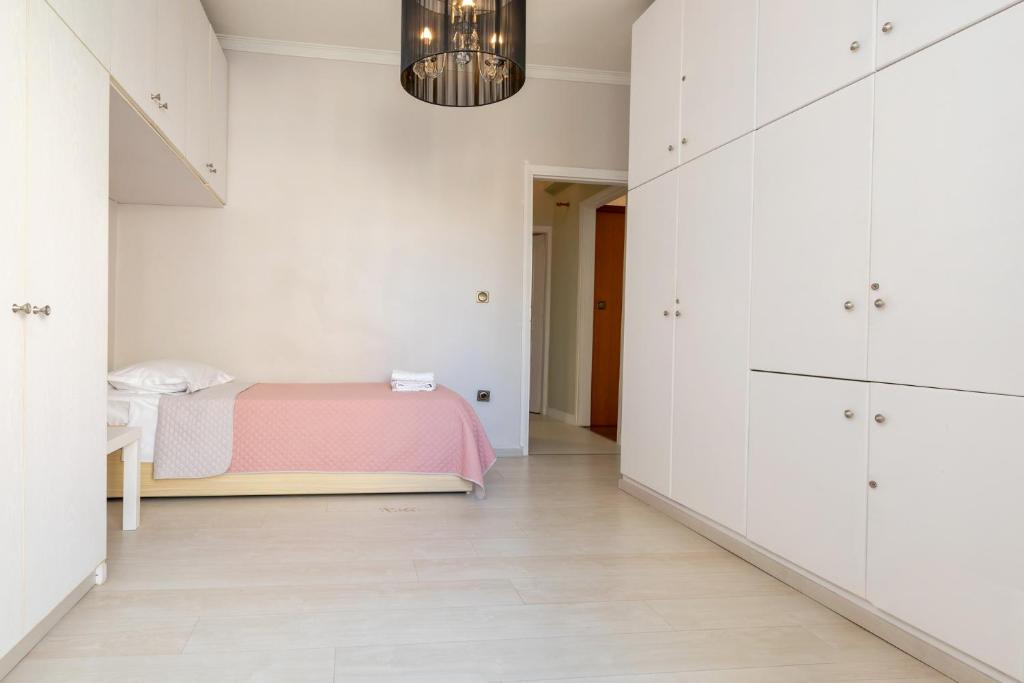 Łóżko lub łóżka w pokoju w obiekcie Chania dream apartment