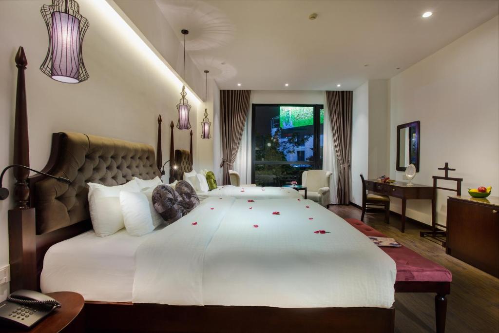 Postel nebo postele na pokoji v ubytování Hanoi Marvellous Hotel & Spa