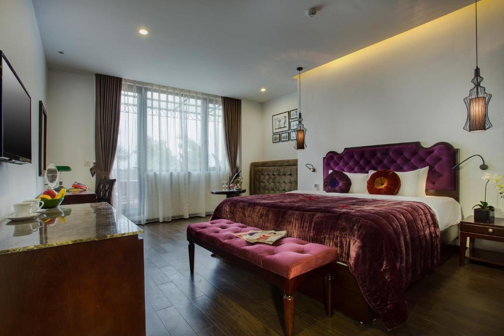 Postel nebo postele na pokoji v ubytování Hanoi Marvellous Hotel & Spa