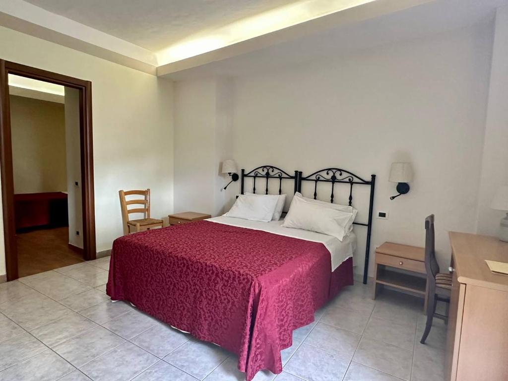 Postel nebo postele na pokoji v ubytování Locanda Fosca Umbra