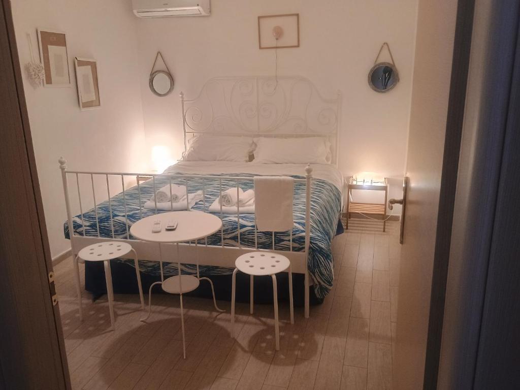 Postel nebo postele na pokoji v ubytování Terrazza Sui Sassi