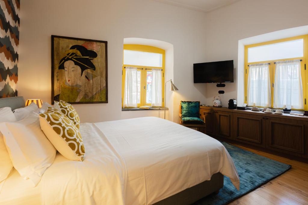 Postel nebo postele na pokoji v ubytování Archo Nafplio Suites & Rooms