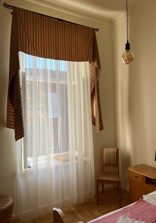 Postel nebo postele na pokoji v ubytování Communa Good Vibes