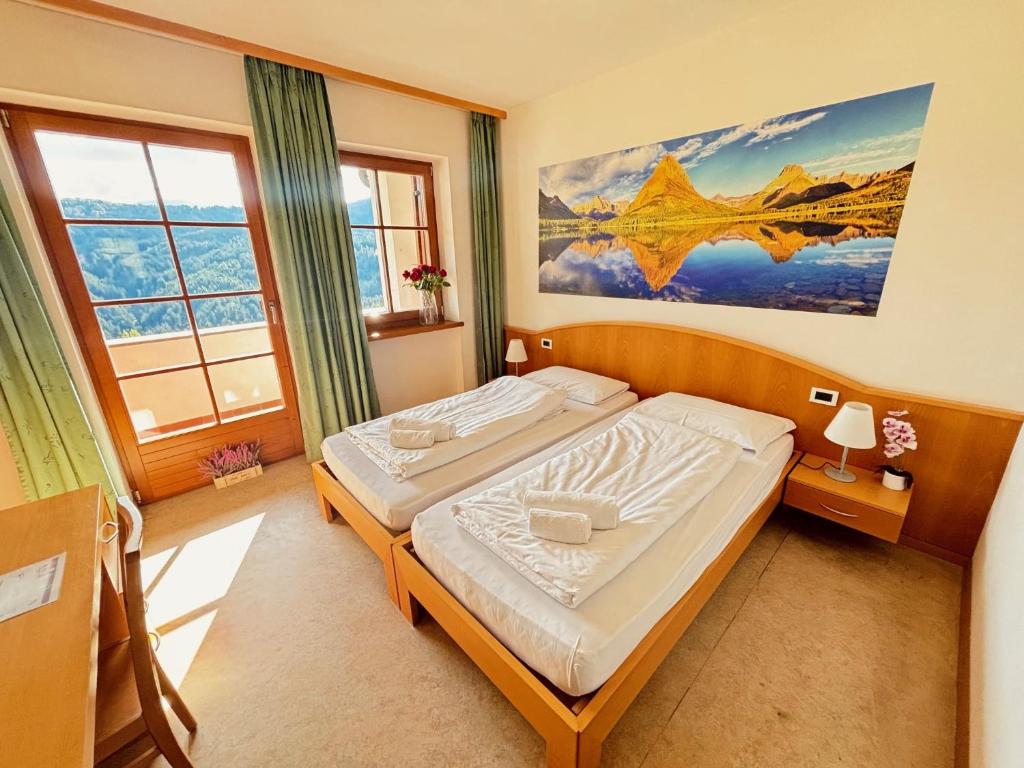 Letto o letti in una camera di Hotel Corno Bianco