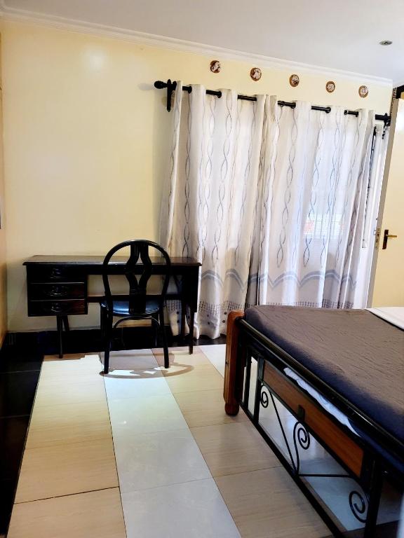 Postel nebo postele na pokoji v ubytování Nairobi Glory Palace Hotel