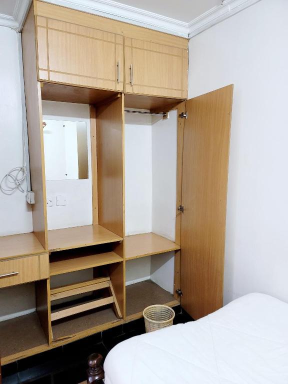 Postel nebo postele na pokoji v ubytování Nairobi Glory Palace Hotel