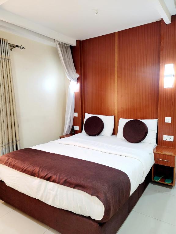 Postel nebo postele na pokoji v ubytování Nairobi Glory Palace Hotel
