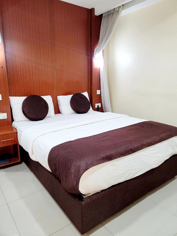 Postel nebo postele na pokoji v ubytování Nairobi Glory Palace Hotel
