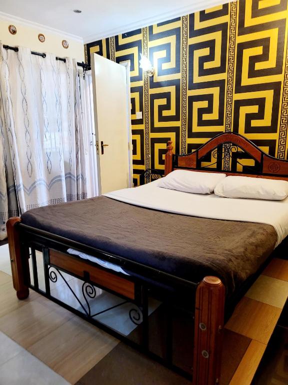 Postel nebo postele na pokoji v ubytování Nairobi Glory Palace Hotel