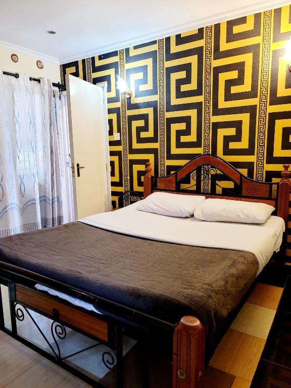 Postel nebo postele na pokoji v ubytování Nairobi Glory Palace Hotel
