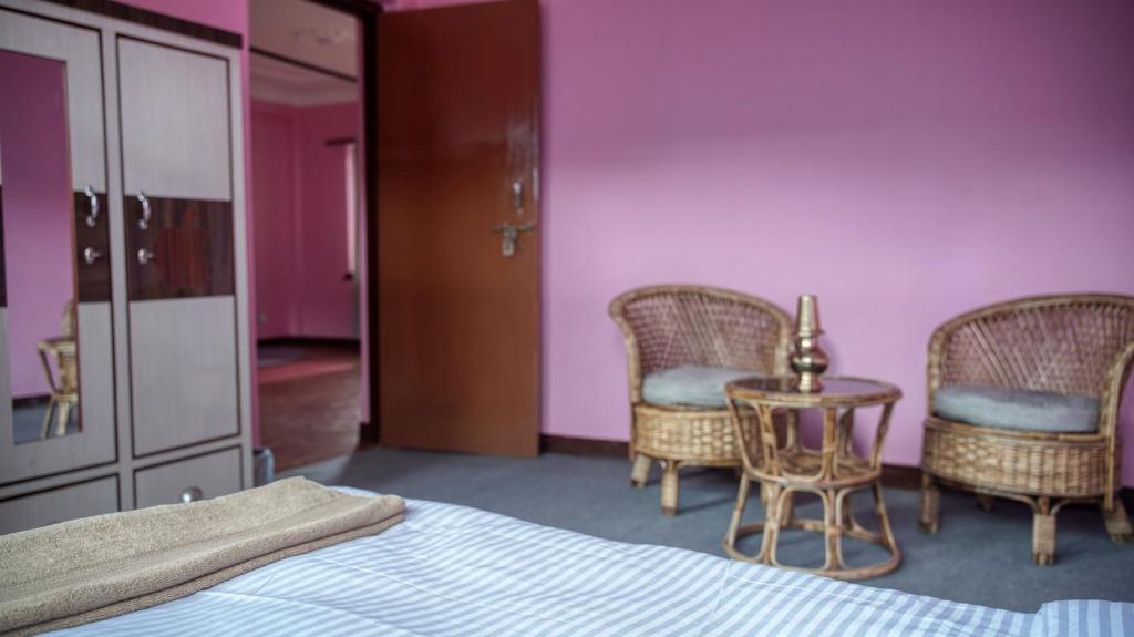 Postel nebo postele na pokoji v ubytování YogStay Homestay in Kathmandu