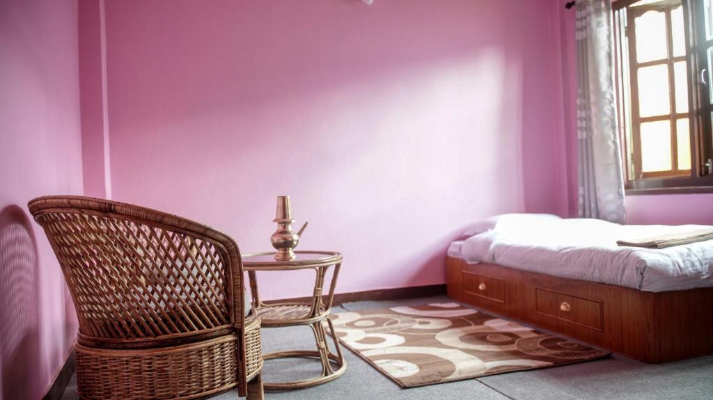 Postel nebo postele na pokoji v ubytování YogStay Homestay in Kathmandu