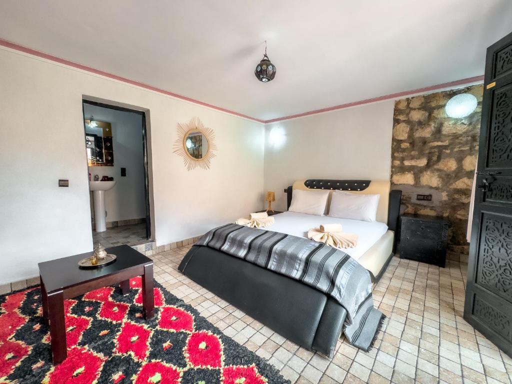 Postel nebo postele na pokoji v ubytování Tonaroz House