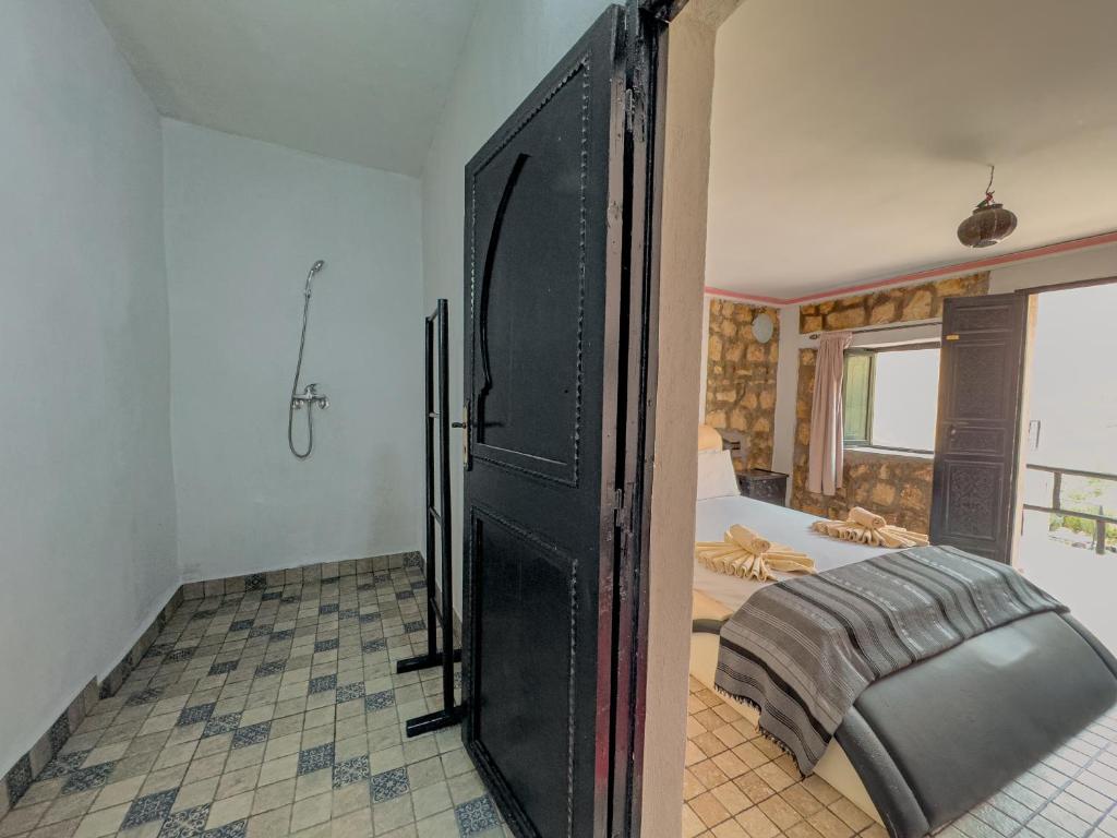 Postel nebo postele na pokoji v ubytování Tonaroz House