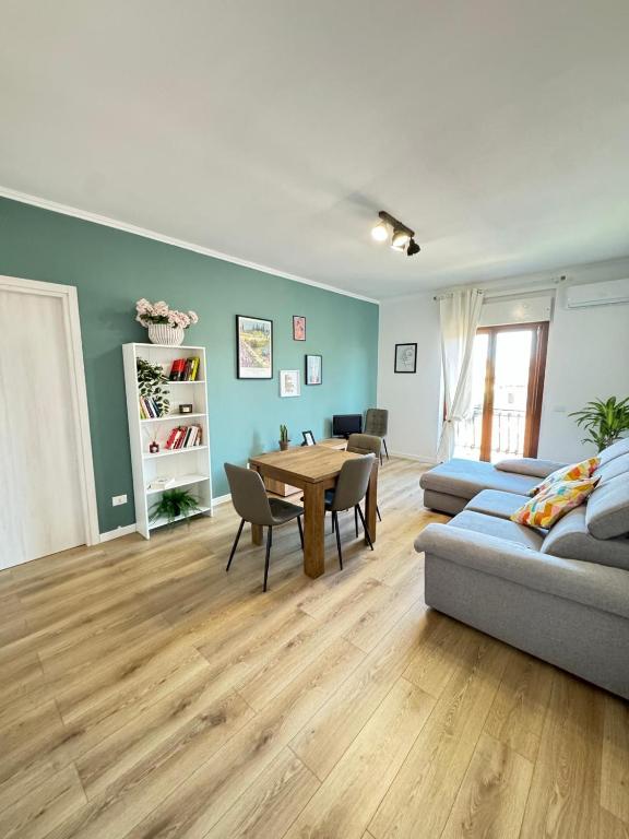 a living room with a couch and a table at La Casa di Enea in Rome