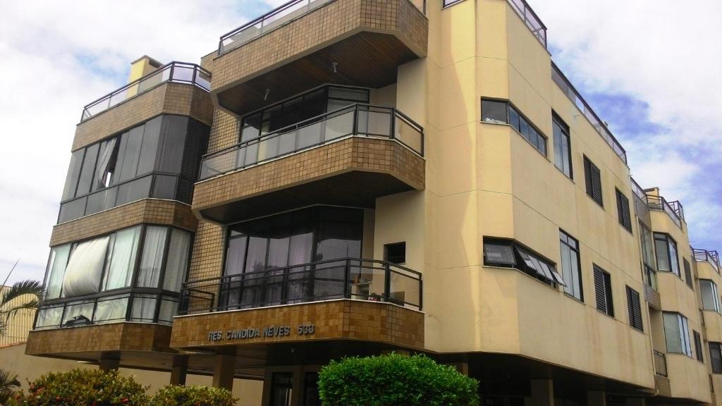 a tall building with balconies on the side of it at Apartamento Rafaelli in Florianópolis