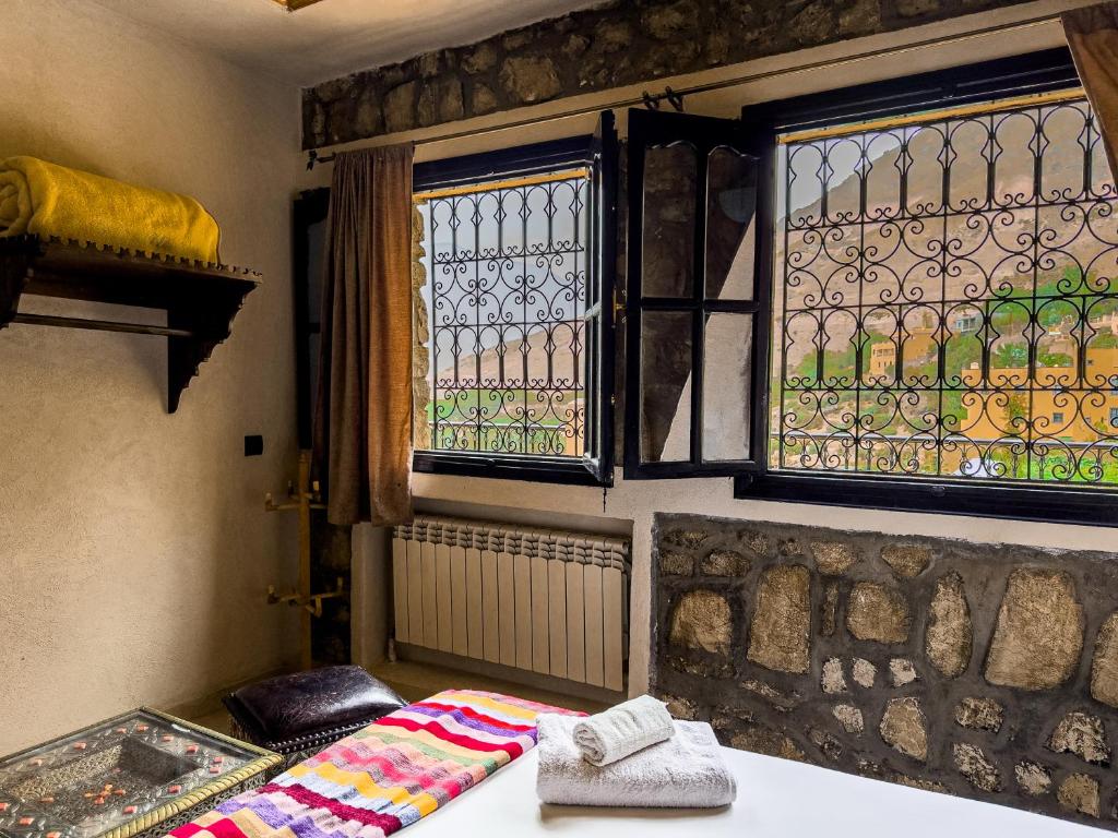 Postel nebo postele na pokoji v ubytování Tonaroz House