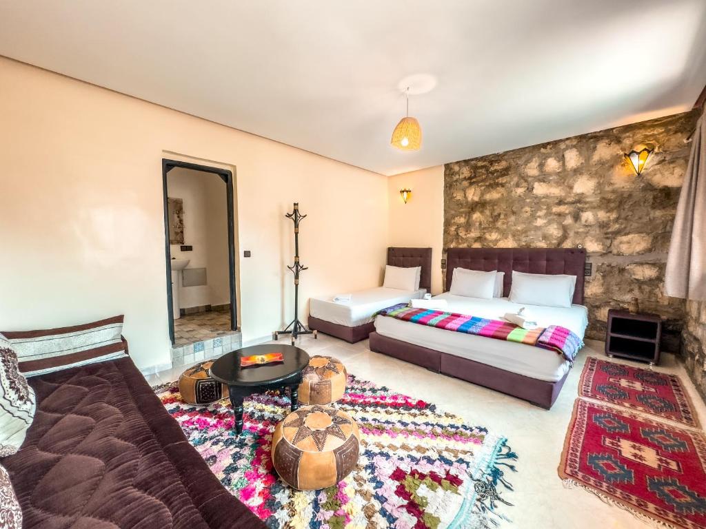 Postel nebo postele na pokoji v ubytování Tonaroz House