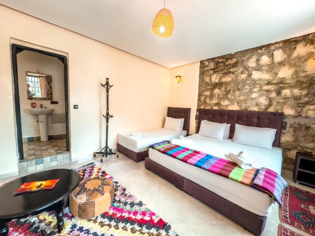 Postel nebo postele na pokoji v ubytování Tonaroz House