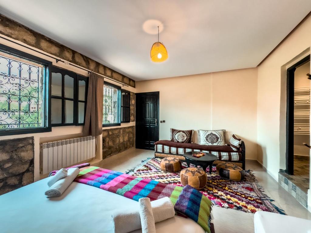 Postel nebo postele na pokoji v ubytování Tonaroz House