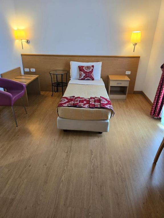 Postel nebo postele na pokoji v ubytování Hotel Marco Polo Airport hotel