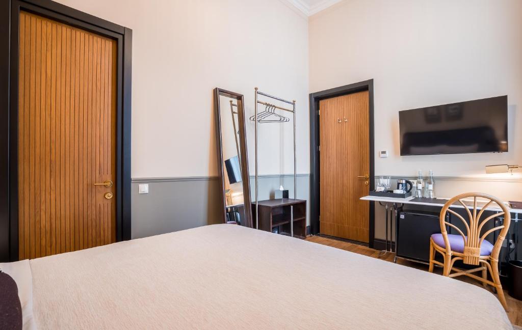 Postel nebo postele na pokoji v ubytování Communal Hotel Kutaisi